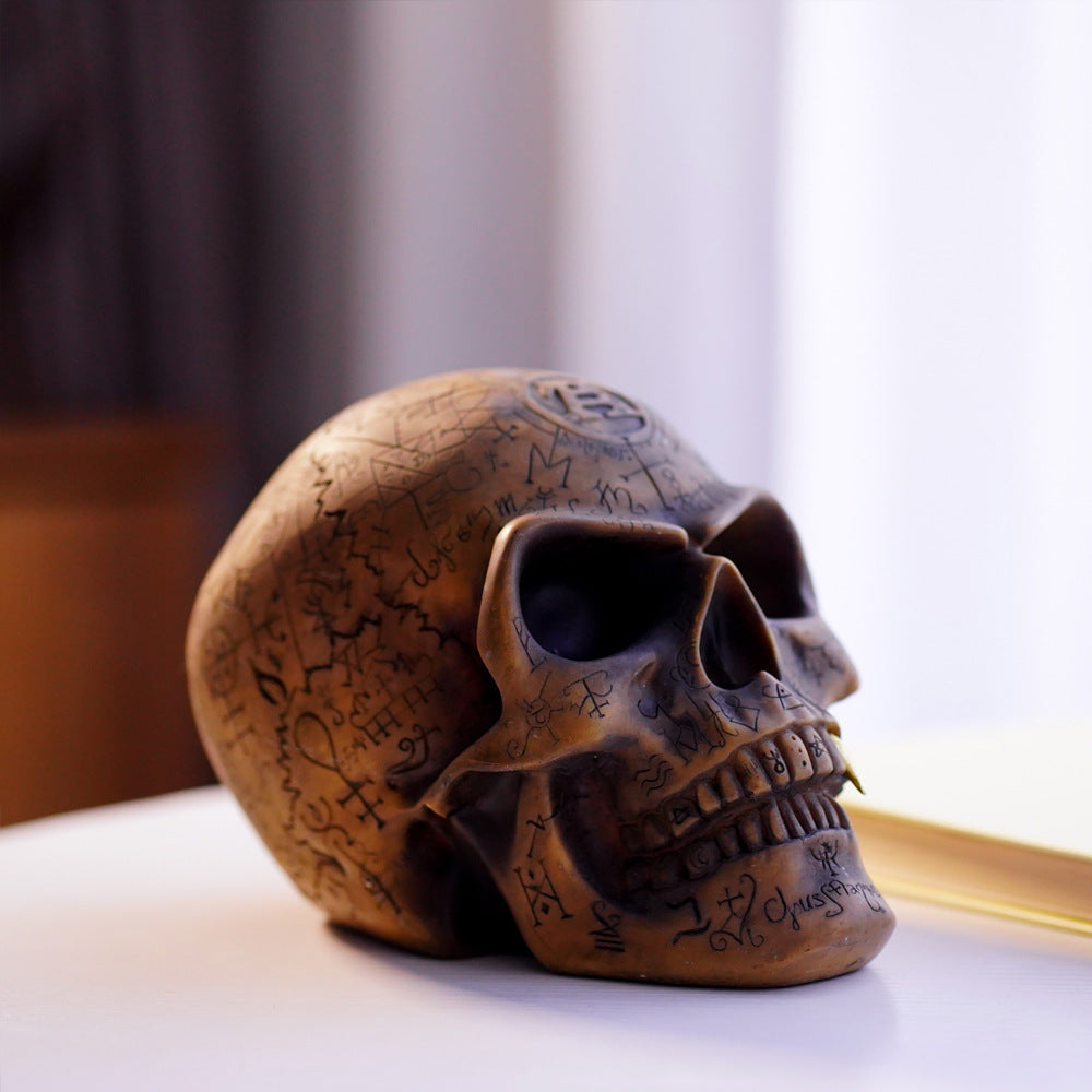 Mystic Runic Skull Statue with Gold Fang – Hand-Painted Resin Gothic Decor Figurine